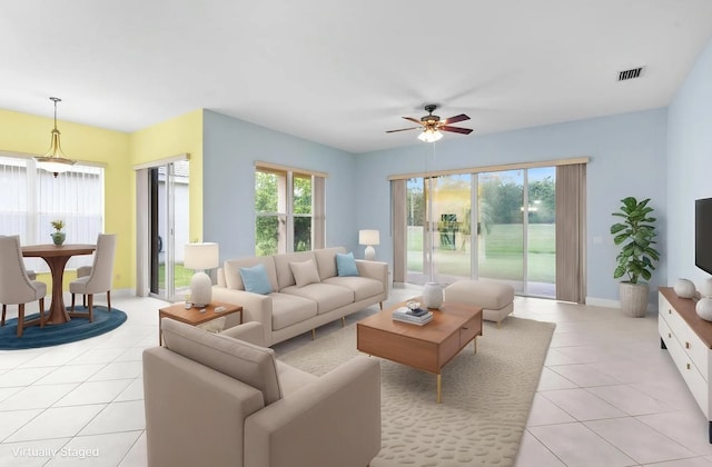 1877 Grey Falcon Cir SW, Vero Beach, FL 32962 - living area with light tile patterned flooring, a ceiling fan, and baseboards