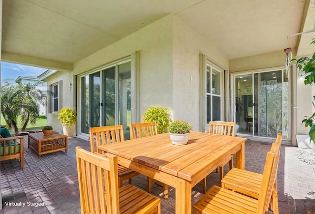 1877 Grey Falcon Cir SW, Vero Beach, FL 32962 - view of patio / terrace featuring an outdoor hangout area and outdoor dining area
