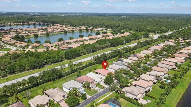1877 Grey Falcon Cir SW, Vero Beach, FL 32962 - aerial perspective of suburban area with a heavily wooded area and a large body of water
