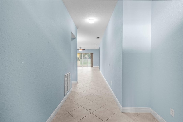 1877 Grey Falcon Cir SW, Vero Beach, FL 32962 - corridor with light tile patterned flooring and baseboards