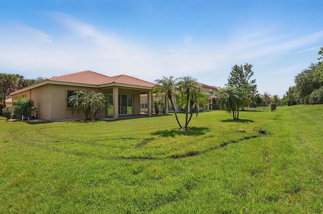 1877 Grey Falcon Cir SW, Vero Beach, FL 32962 - view of grassy yard