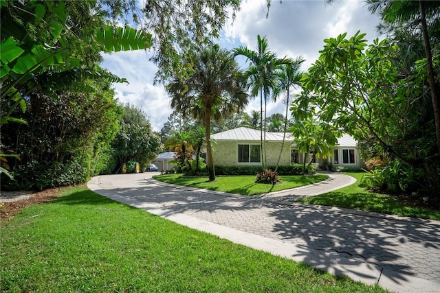 ranch-style home featuring a front yard