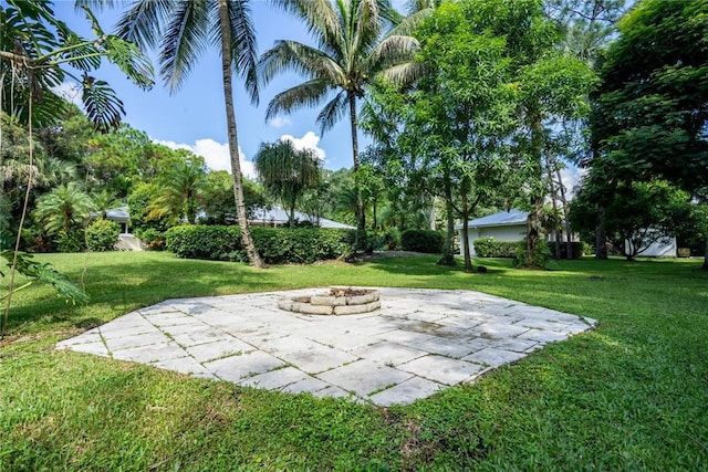 view of yard with a patio area and a fire pit