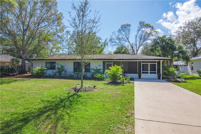 ranch-style house with a sunroom and a front yard