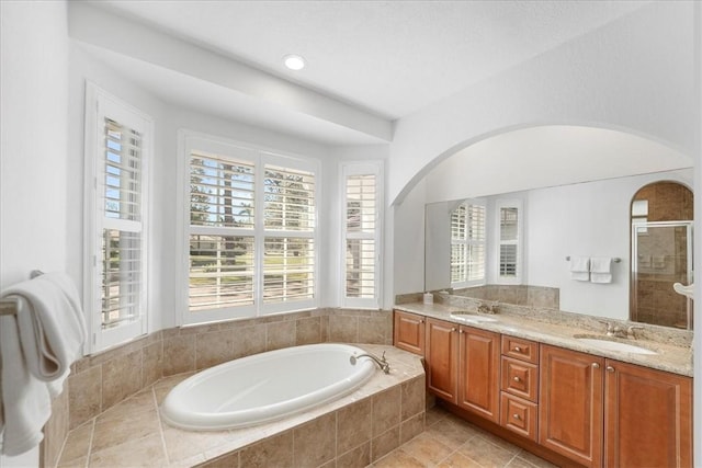 bathroom featuring vanity, tile patterned flooring, and independent shower and bath