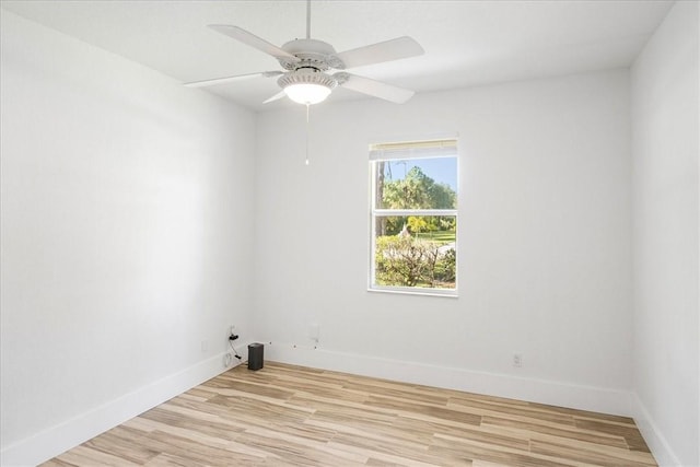 empty room featuring ceiling fan and light hardwood / wood-style floors