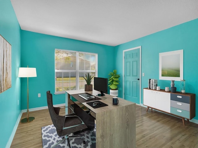 5985 Ridge Lake Cir, Vero Beach, FL 32967 - office area featuring wood finished floors and baseboards