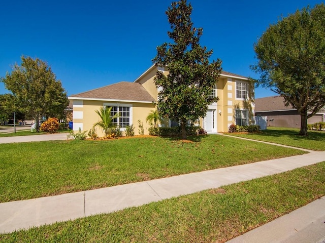 5985 Ridge Lake Cir, Vero Beach, FL 32967 - view of front of home featuring a front lawn and stucco siding