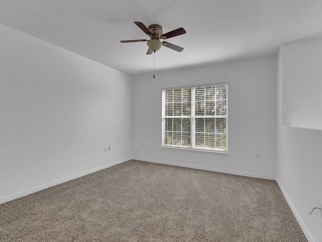 5985 Ridge Lake Cir, Vero Beach, FL 32967 - carpeted spare room with a ceiling fan and baseboards