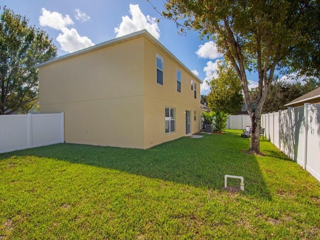 5985 Ridge Lake Cir, Vero Beach, FL 32967 - view of side of home with a fenced backyard and stucco siding