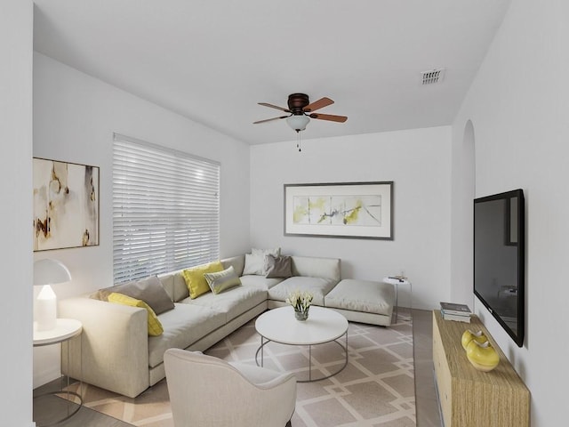5985 Ridge Lake Cir, Vero Beach, FL 32967 - living room with arched walkways and a ceiling fan