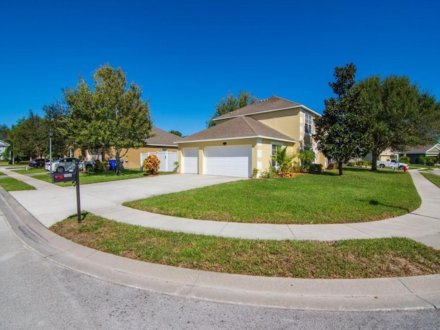 5985 Ridge Lake Cir, Vero Beach, FL 32967 - view of front of house with a garage, a front yard, concrete driveway, and stucco siding