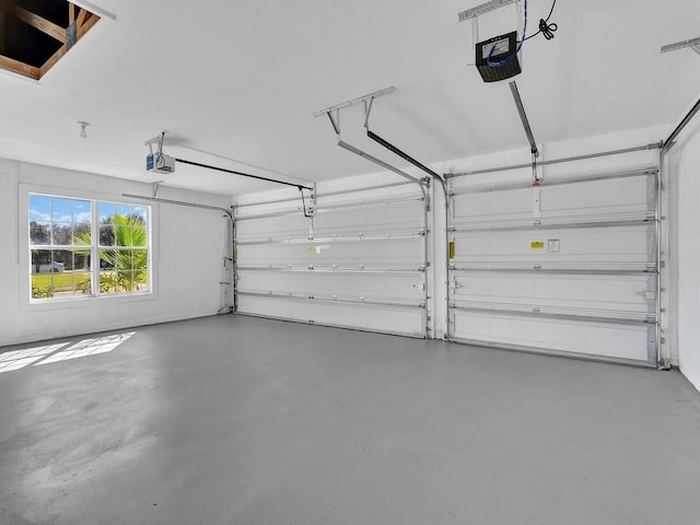 5985 Ridge Lake Cir, Vero Beach, FL 32967 - garage featuring a garage door opener