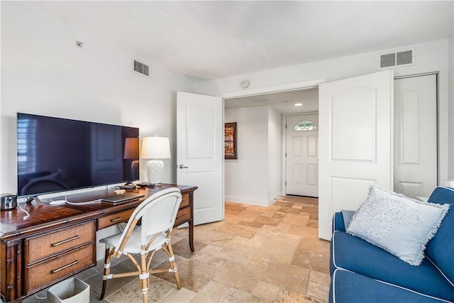 2700 Ocean Dr Unit 405, Vero Beach, FL 32963 - office area with stone tile floors, visible vents, and baseboards