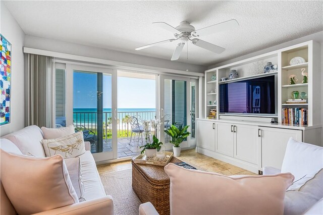 2700 Ocean Dr Unit 405, Vero Beach, FL 32963 - living area with ceiling fan and a textured ceiling