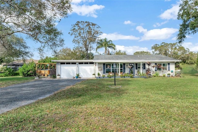 single story home featuring a front yard and a garage