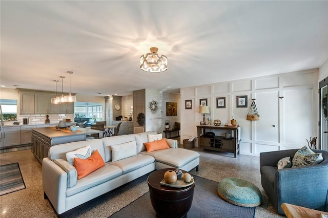 living room with an inviting chandelier