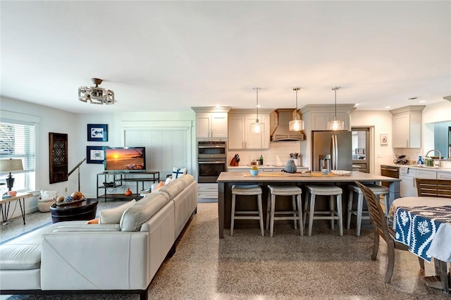 living room featuring sink