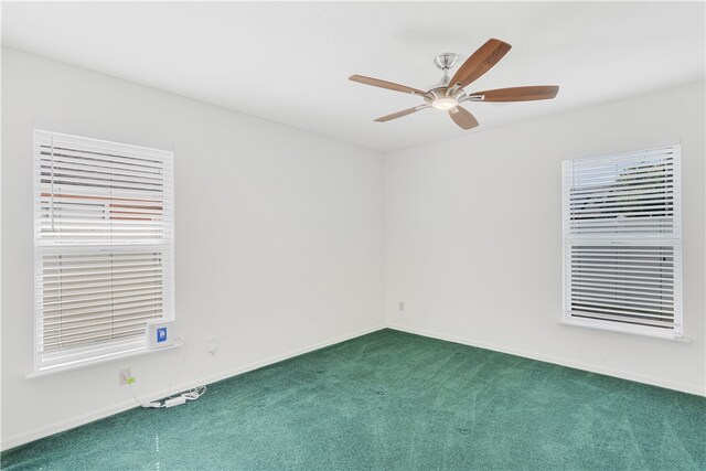 carpeted empty room with ceiling fan