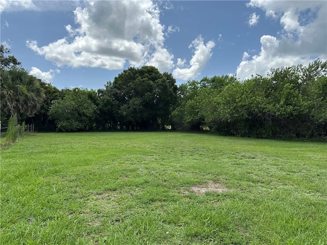 4065 62nd Ct, Vero Beach, FL 32966 - view of grassy yard with a view of trees and a view of countryside