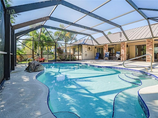 view of swimming pool with a patio and glass enclosure