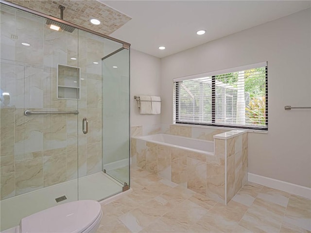 bathroom featuring separate shower and tub and toilet