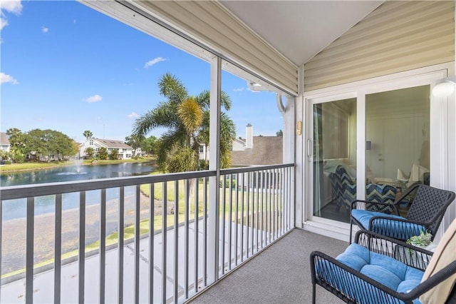 balcony featuring a water view
