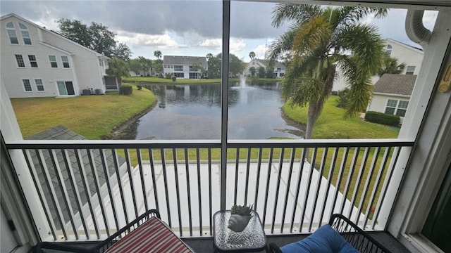 balcony featuring a water view and a residential view