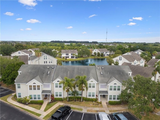 aerial perspective of suburban area featuring a nearby body of water