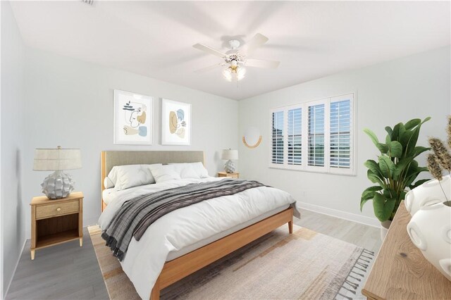 1122 4th Ln SW, Vero Beach, FL 32962 - bedroom with light wood-style flooring, baseboards, and ceiling fan