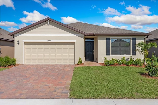 view of front of house featuring a garage and a front yard