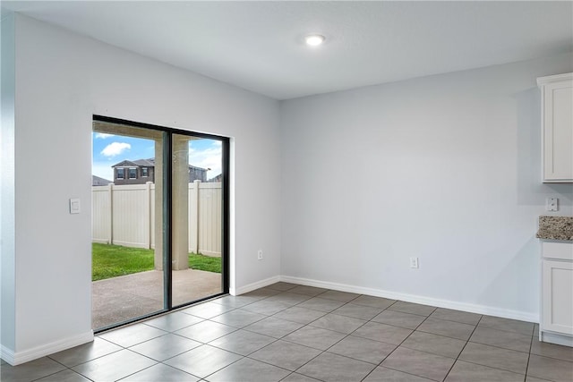 spare room with light tile patterned floors