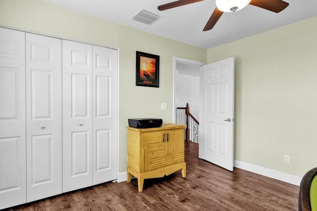 interior space featuring ceiling fan and dark hardwood / wood-style flooring