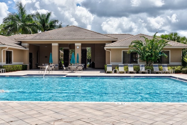 view of pool featuring a patio