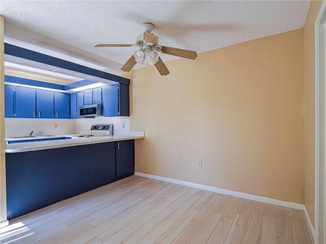 kitchen featuring electric stove, blue cabinetry, ceiling fan, a textured ceiling, and light wood-type flooring