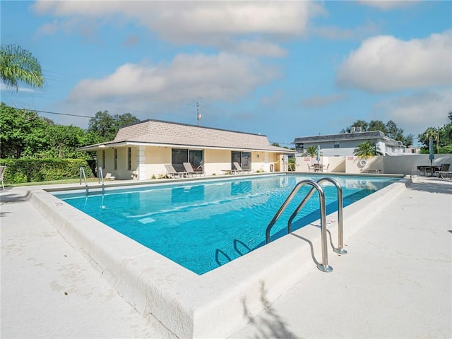 view of swimming pool with a patio