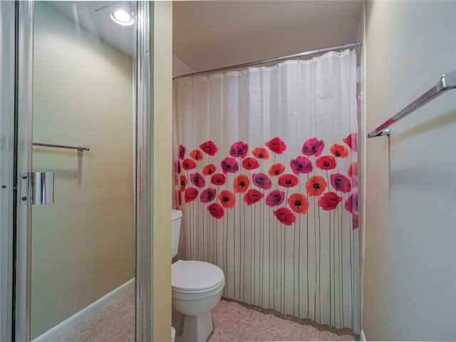 bathroom with toilet and curtained shower