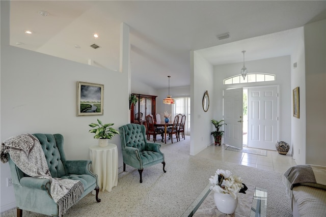 foyer with high vaulted ceiling