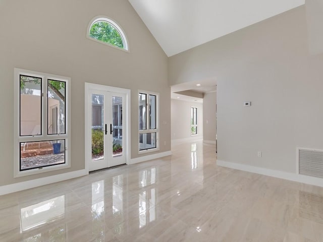 8405 Red Bay Ct Unit 8405, Vero Beach, FL 32963 - spare room with french doors, baseboards, high vaulted ceiling, and visible vents