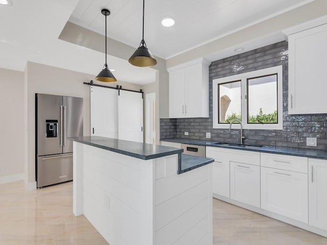 8405 Red Bay Ct Unit 8405, Vero Beach, FL 32963 - kitchen featuring tasteful backsplash, a center island, a sink, and high end fridge