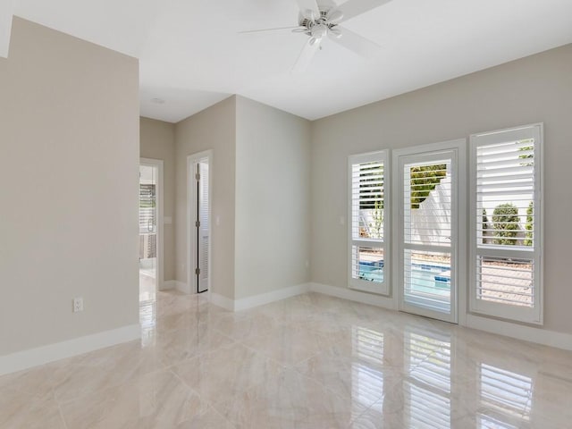 8405 Red Bay Ct Unit 8405, Vero Beach, FL 32963 - empty room with baseboards, a ceiling fan, and marble finish floor