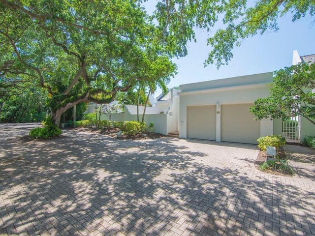 8405 Red Bay Ct Unit 8405, Vero Beach, FL 32963 - view of front of home featuring a garage, stucco siding, and decorative driveway