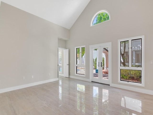 8405 Red Bay Ct Unit 8405, Vero Beach, FL 32963 - spare room with baseboards, high vaulted ceiling, and french doors