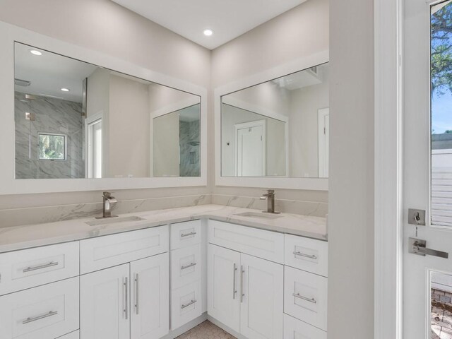 8405 Red Bay Ct Unit 8405, Vero Beach, FL 32963 - bathroom with a sink, a marble finish shower, and double vanity