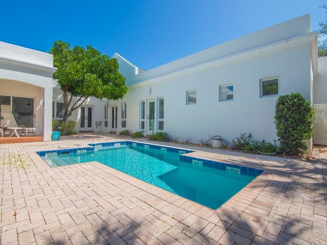 8405 Red Bay Ct Unit 8405, Vero Beach, FL 32963 - outdoor pool featuring a patio area and french doors