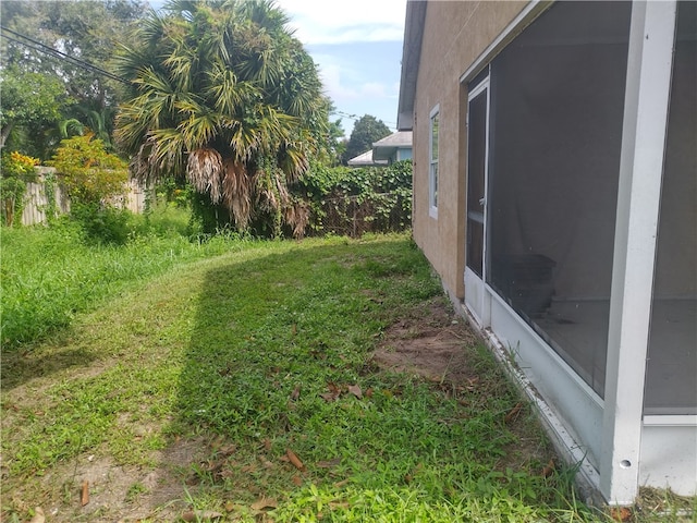 view of yard with a sunroom