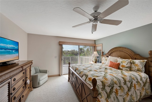 bedroom featuring access to exterior, ceiling fan, light colored carpet, and a textured ceiling