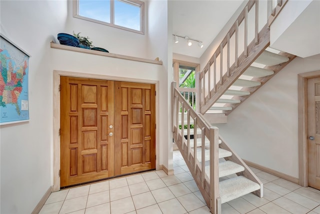 tiled entrance foyer with track lighting