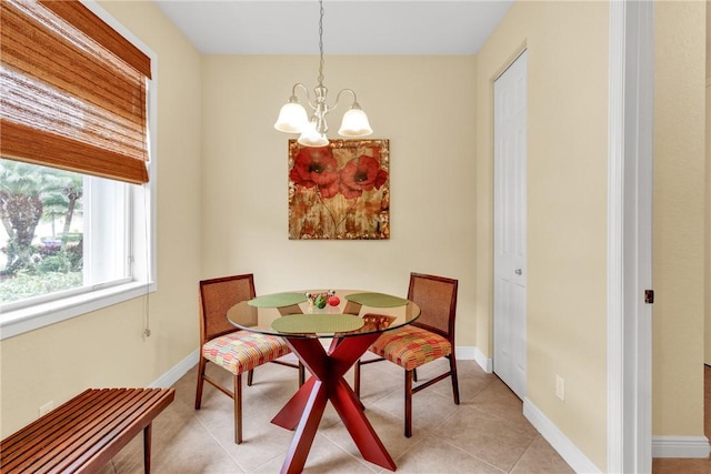 dining room with an inviting chandelier and light tile patterned floors