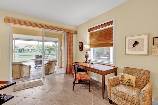 office space with plenty of natural light and light tile patterned flooring